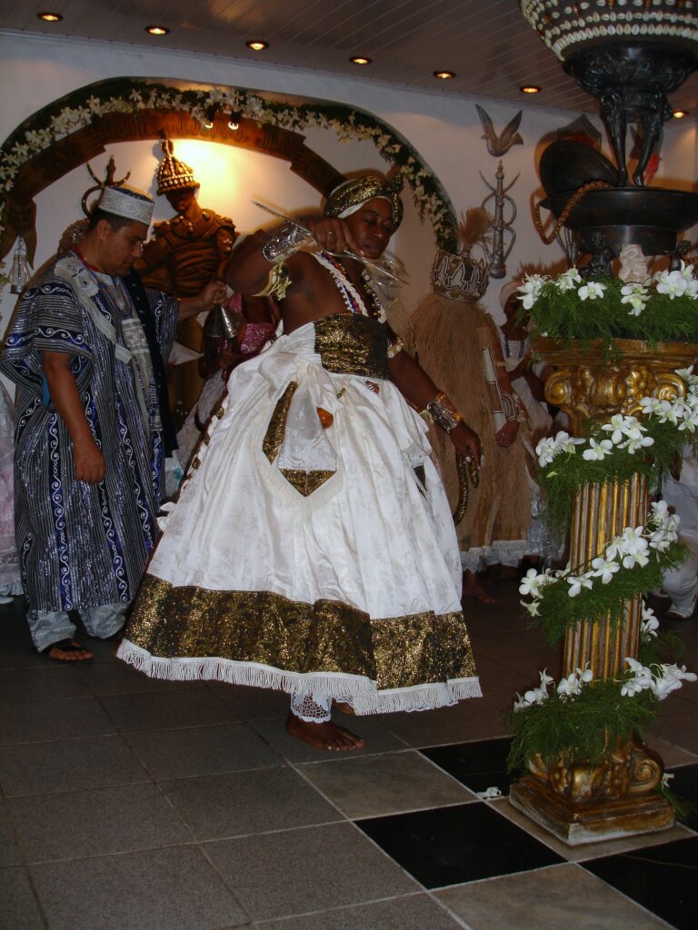 A Candomblé priestess manifesting the orixá Oxumaré during ceremony, Brazil.