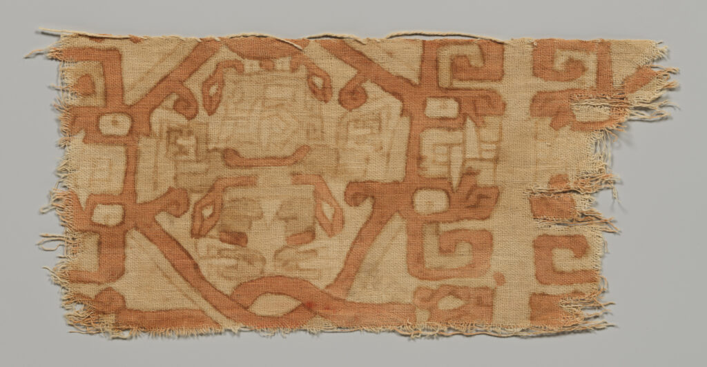 Fragment of painted cotton textile depicting a supernatural fanged figure with serpent hair, serpent belt, and raptor claws, in Chavín style, Peru, 4th–3rd century BCE.