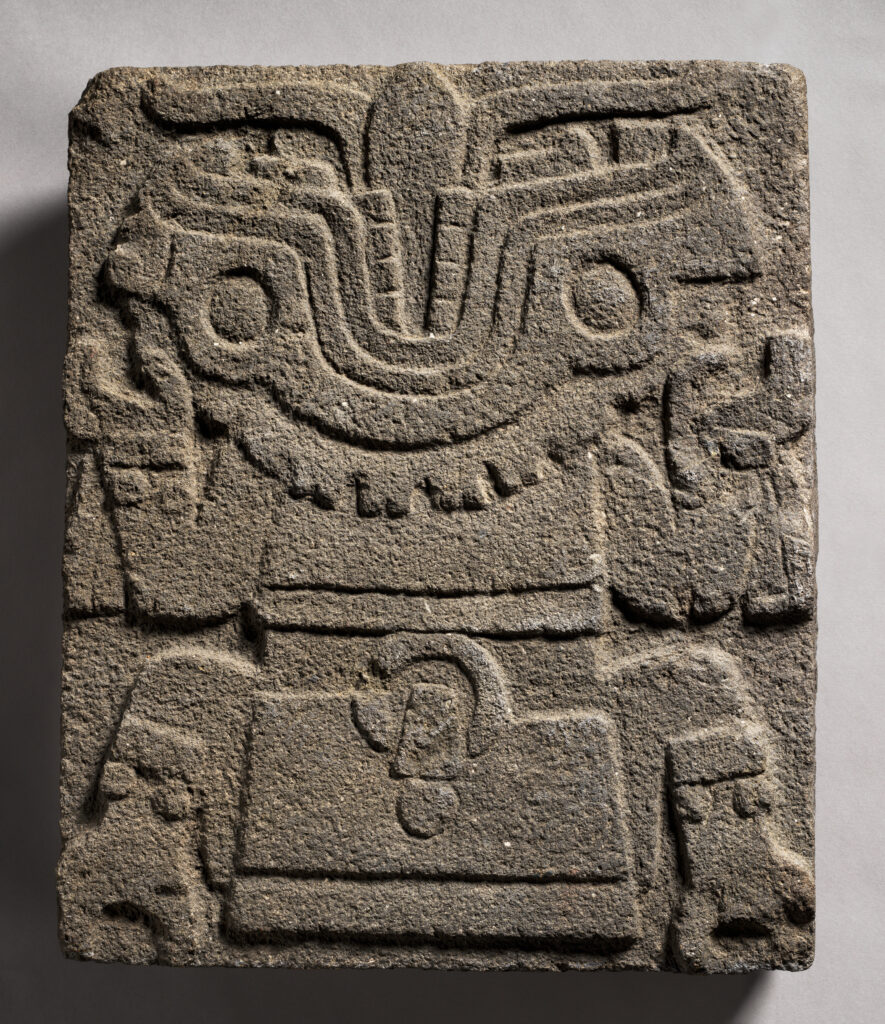 Stone sculpture of Tlaltecuhtli, the Aztec earth deity, depicted as a crouching figure with clawed hands and feet, a wide-open mouth with a split tongue, and bulbous eyes. Mexica (Aztec), 1450–1521, Metropolitan Museum of Art.