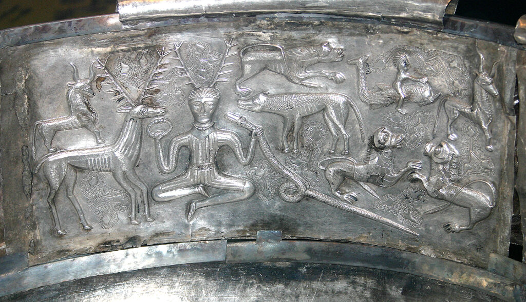 Silver relief plate showing a horned seated figure holding a torc and a ram-horned serpent, Gundestrup Cauldron, National Museum of Denmark.