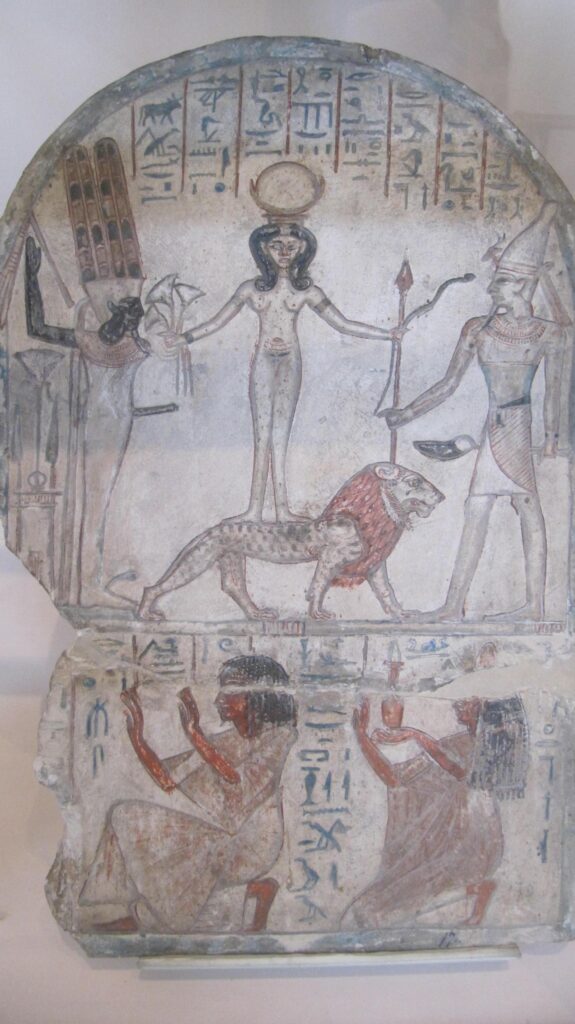 Egyptian stele showing the goddess Qadesh standing on a lion and holding a serpent, flanked by the gods Min and Reshep, ca. 1294–1213 BCE, Museo Egizio, Turin.